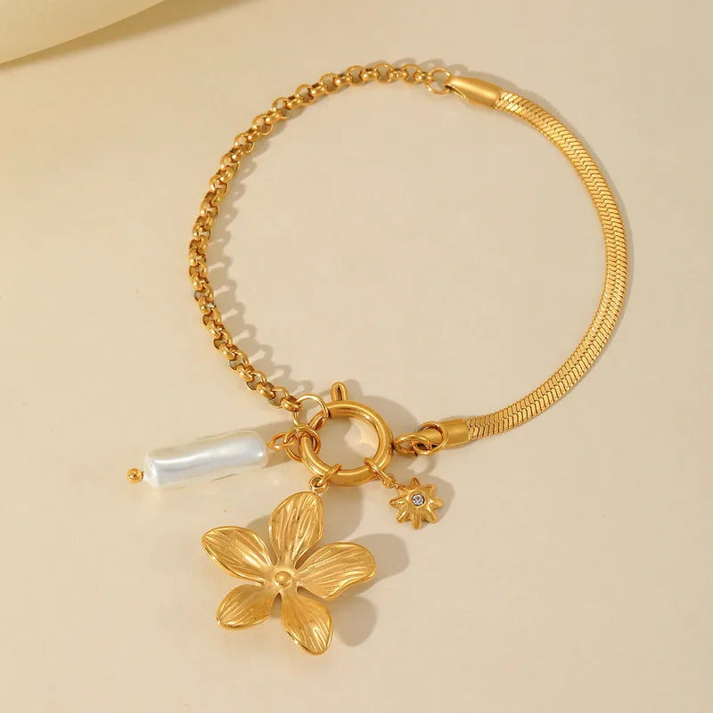 PULSERA DE CHARMS FLOR Y PERLA