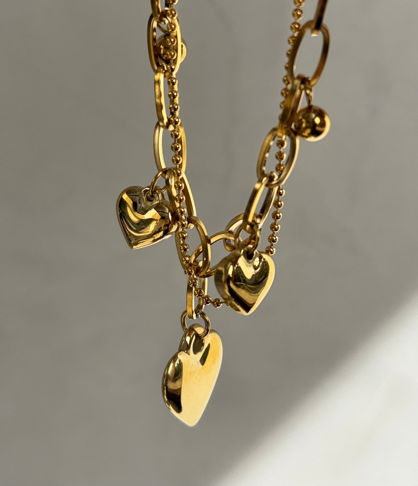 BRAZALETE CORAZONES DORADO