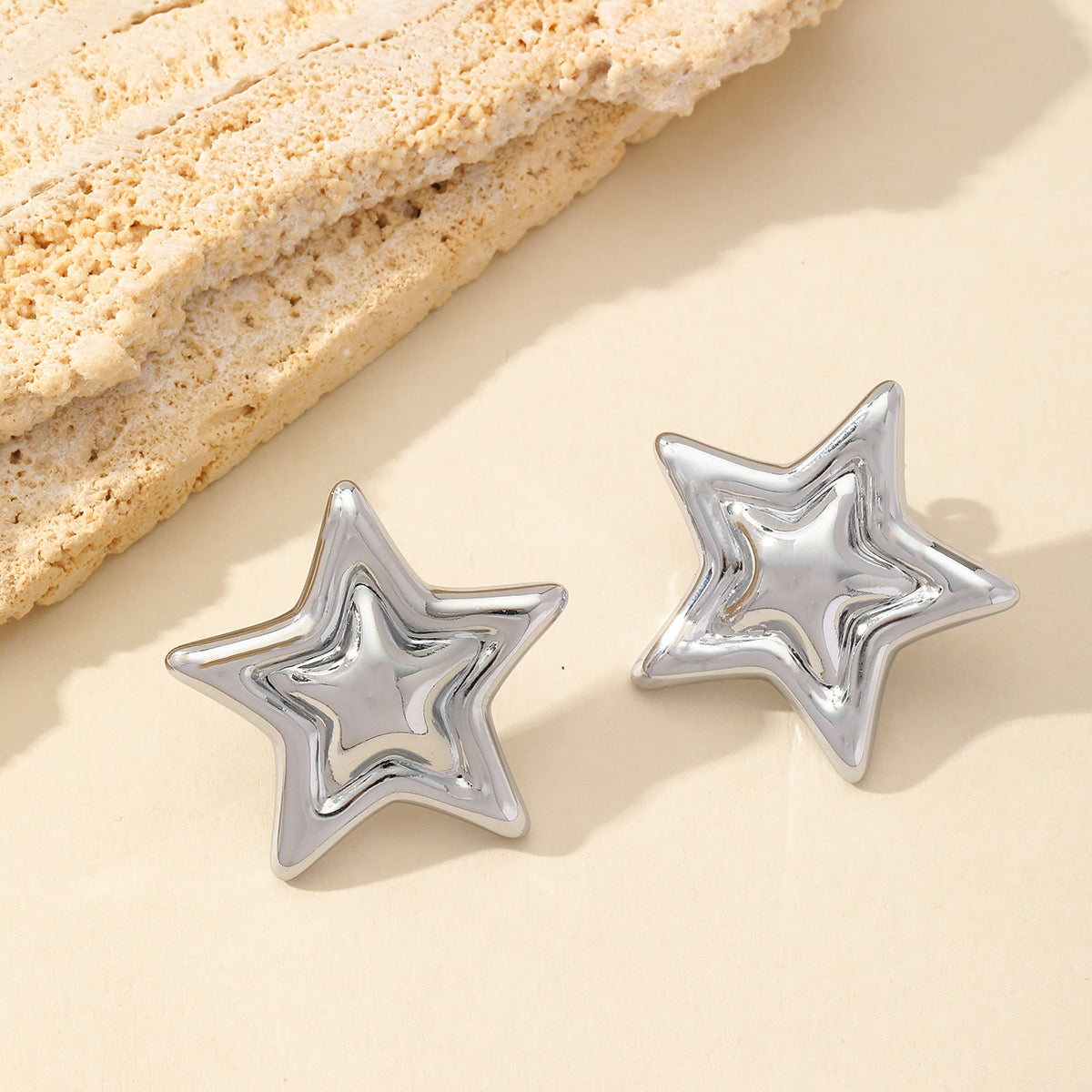 ARETE DOBLE ESTRELLA PLATEADO