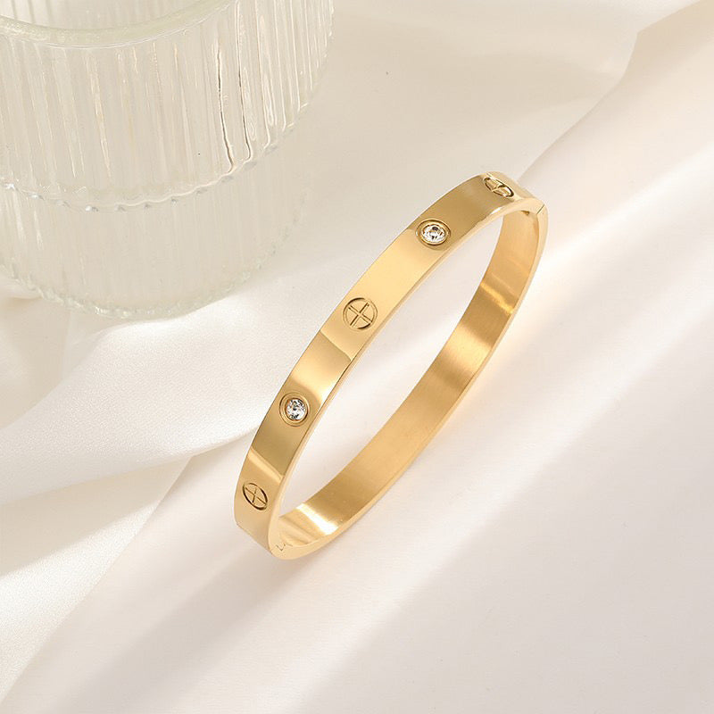 BRAZALETE ACERO CON ZIRCONIA DORADO