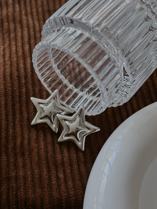 ARETE DOBLE ESTRELLA PLATEADO